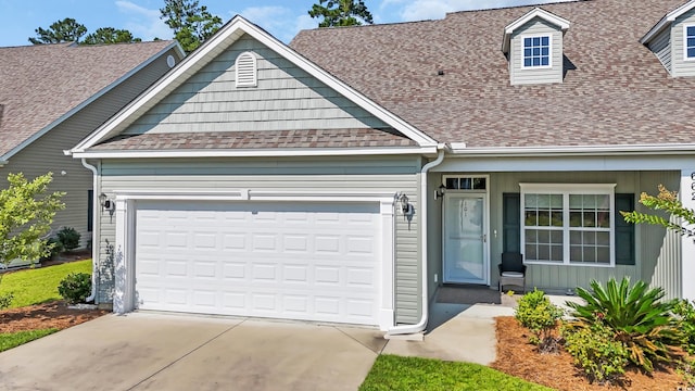 662 Sunnyside Dr Unit 101, Murrells Inlet, SC 29576 - view of front of property with roof with shingles, concrete driveway, and a garage