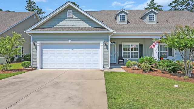 662 Sunnyside Dr Unit 101, Murrells Inlet, SC 29576 - view of front facade featuring roof with shingles, driveway, a front yard, and an attached garage