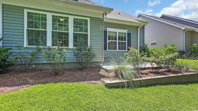 662 Sunnyside Dr Unit 101, Murrells Inlet, SC 29576 - view of property exterior with a lawn and a shingled roof