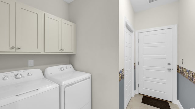 662 Sunnyside Dr Unit 101, Murrells Inlet, SC 29576 - laundry room featuring independent washer and dryer and cabinet space