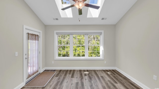 662 Sunnyside Dr Unit 101, Murrells Inlet, SC 29576 - empty room with a skylight, healthy amount of natural light, a ceiling fan, wood finished floors, and lofted ceiling