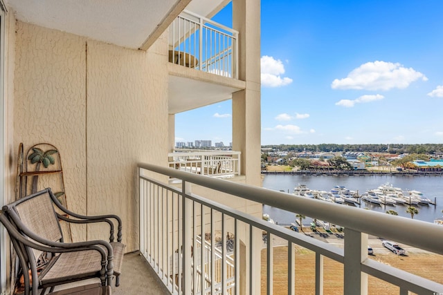 balcony with a water view and a city view