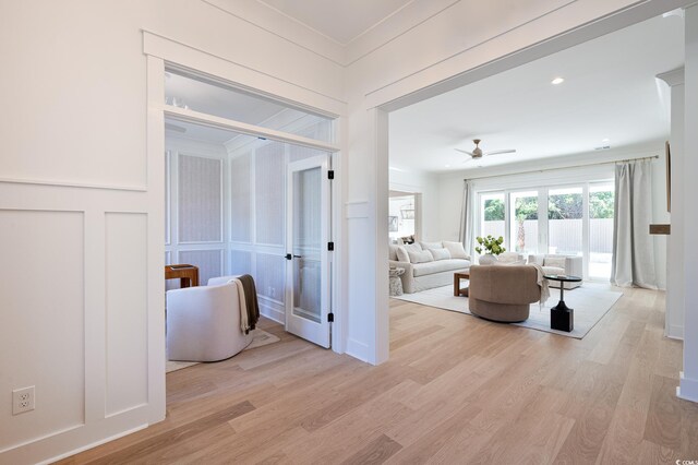 1328 Foxtail Dr, Longs, SC 29568 - hallway with a decorative wall, light wood-style floors, and ornamental molding