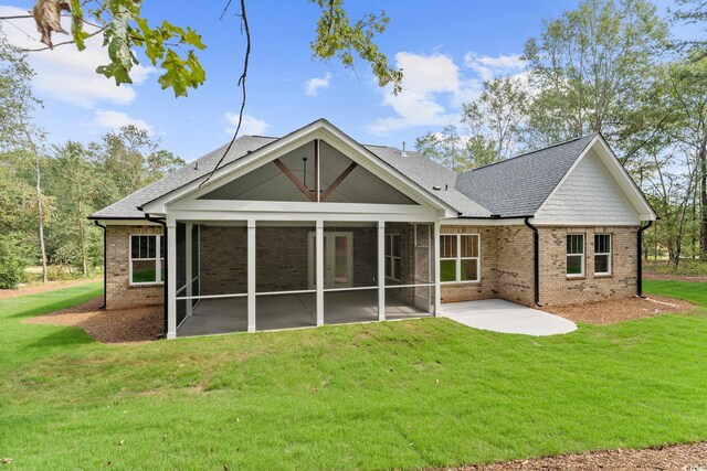 1328 Foxtail Dr, Longs, SC 29568 - rear view of property with brick siding, a sunroom, a patio area, and roof with shingles