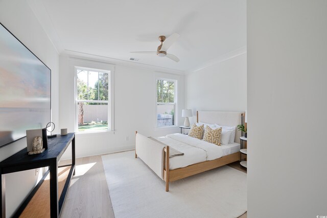 1328 Foxtail Dr, Longs, SC 29568 - bedroom featuring wood finished floors, ornamental molding, baseboards, and ceiling fan