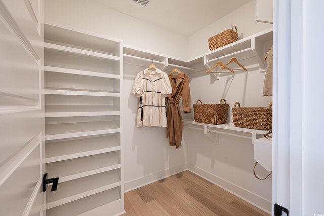 1328 Foxtail Dr, Longs, SC 29568 - walk in closet with wood finished floors