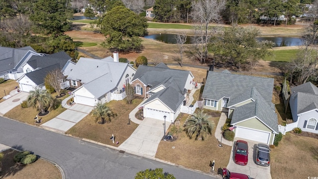 aerial view featuring a water view and a residential view