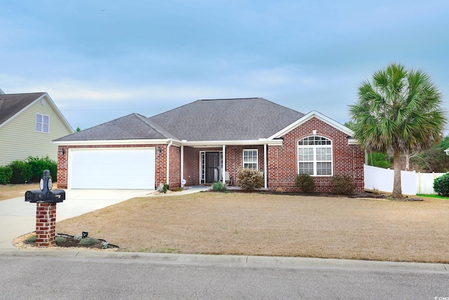 ranch-style home featuring driveway, a garage, fence, and brick siding