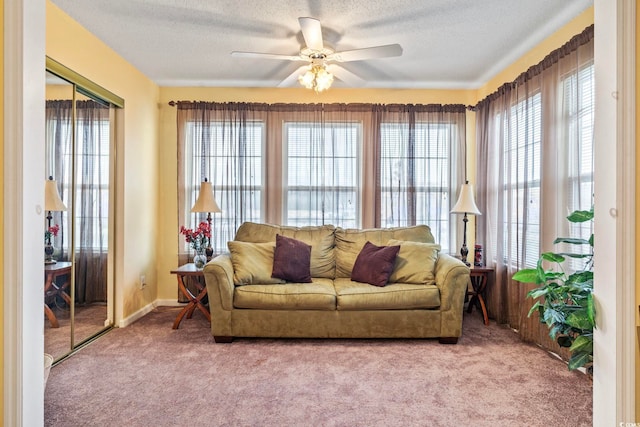 2276 Essex Dr Unit H, Surfside Beach, SC 29575 - living room featuring healthy amount of natural light, a ceiling fan, carpet floors, and a textured ceiling
