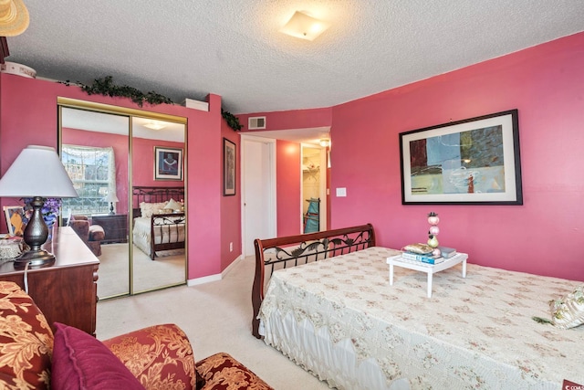 2276 Essex Dr Unit H, Surfside Beach, SC 29575 - bedroom featuring light colored carpet, a textured ceiling, and a closet