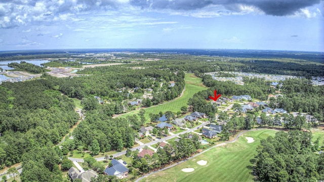 aerial view featuring view of golf course, a water view, and a wooded view