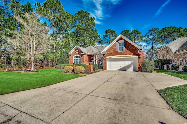 traditional-style home with concrete driveway, brick siding, and a front lawn