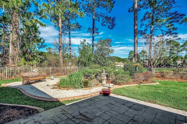 view of yard with a patio and fence