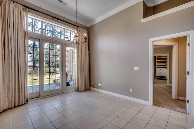 interior space with light tile patterned floors, visible vents, baseboards, an inviting chandelier, and crown molding