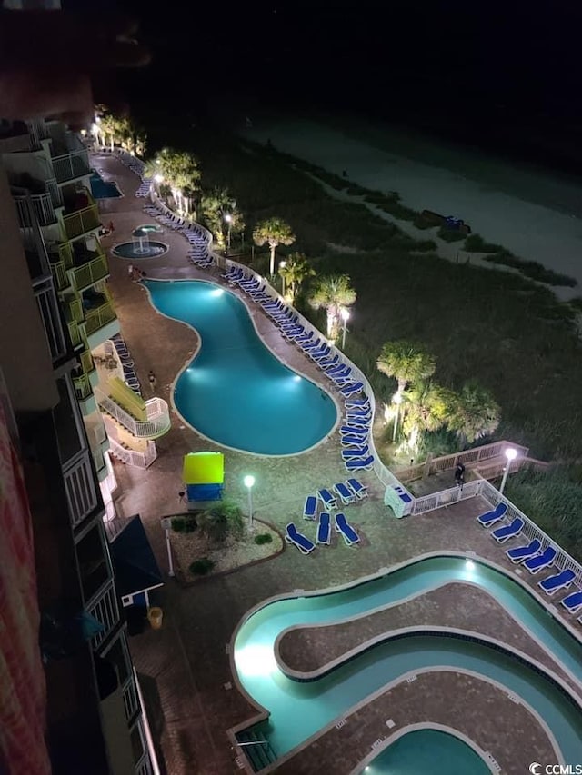 view of pool at night