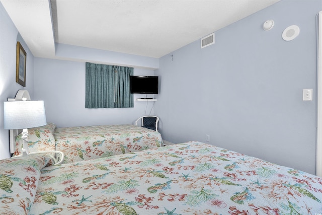 bedroom with visible vents