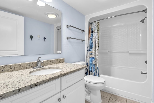 full bath featuring shower / bath combo with shower curtain, tile patterned flooring, vanity, and toilet
