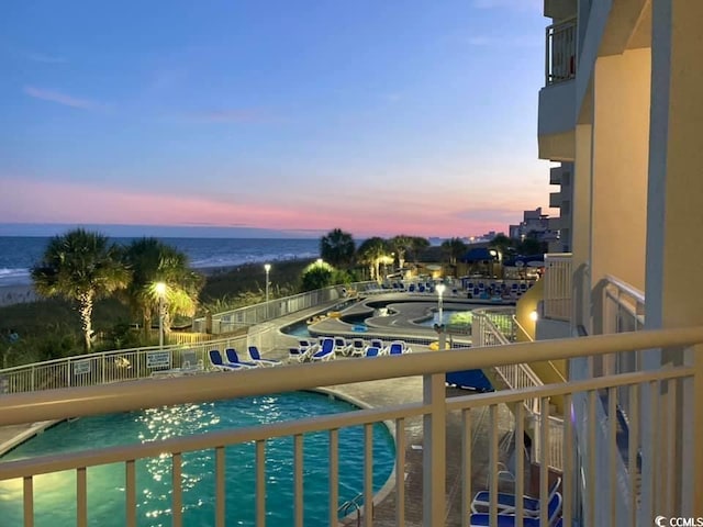 balcony featuring a water view