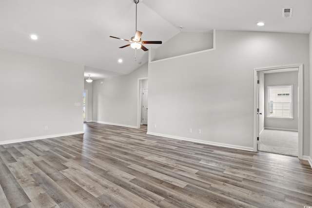 unfurnished living room featuring ceiling fan, baseboards, and light wood-style floors