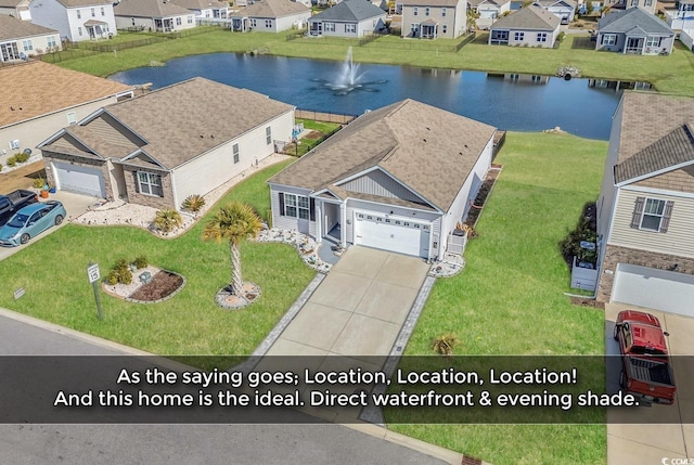 bird's eye view with a water view and a residential view