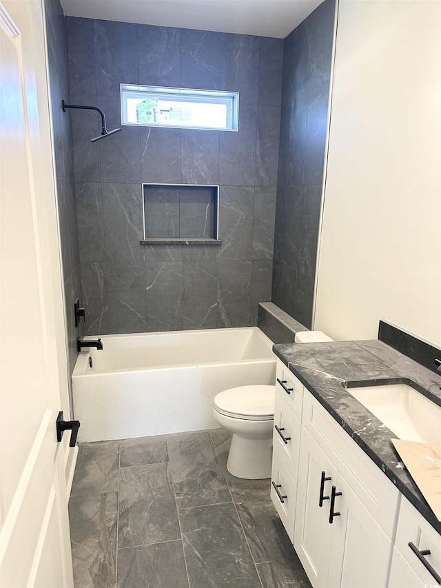 bathroom with toilet, marble finish floor, bathtub / shower combination, and vanity