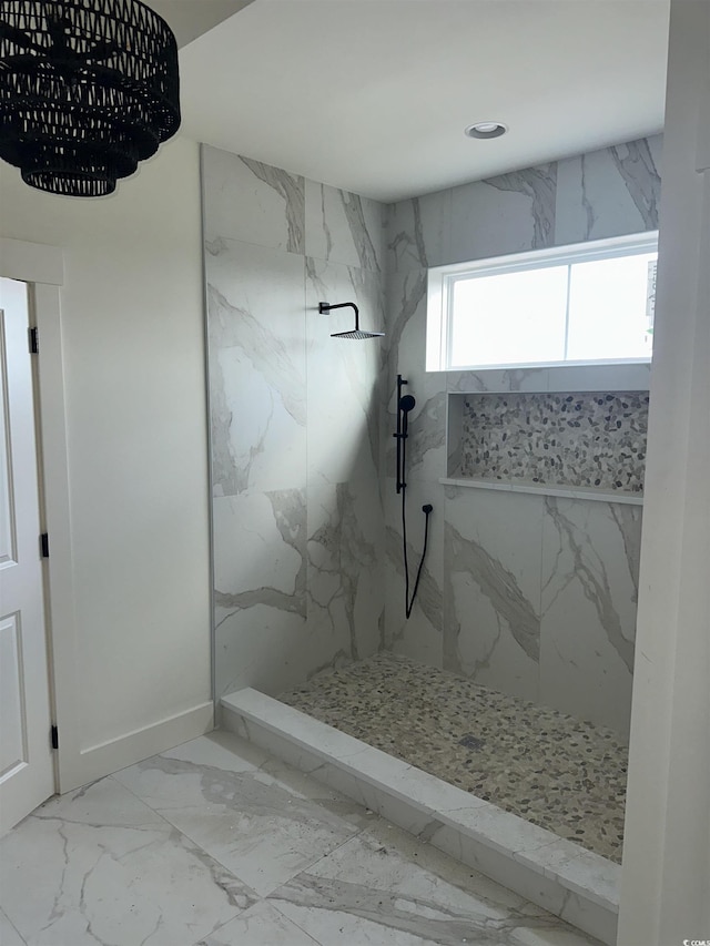 bathroom featuring recessed lighting, marble finish floor, and a marble finish shower