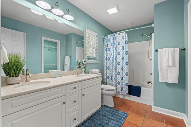 full bathroom featuring double vanity, shower / tub combo, tile patterned flooring, and a sink