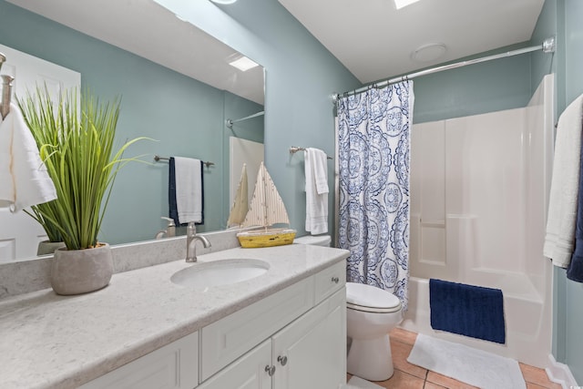 bathroom with shower / bath combo, vanity, toilet, and tile patterned floors