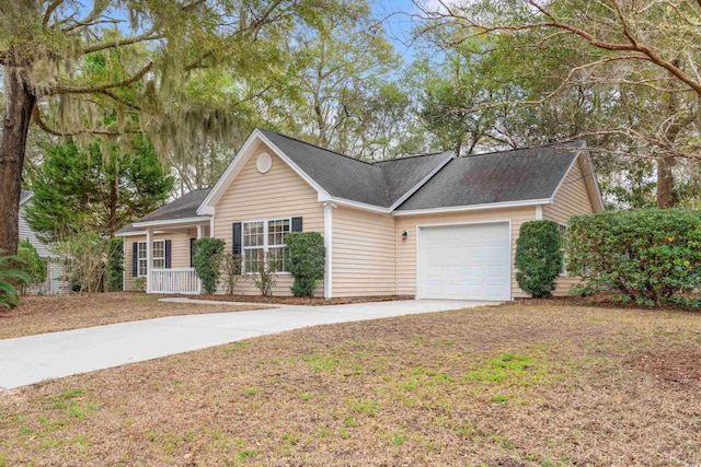 ranch-style house with driveway, covered porch, and an attached garage