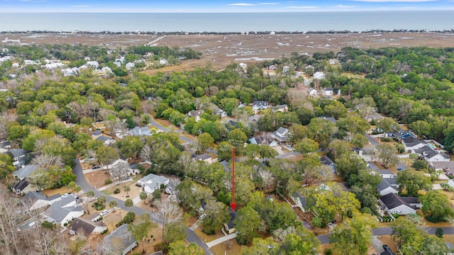 drone / aerial view featuring a residential view and a water view