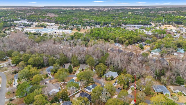 aerial view with a residential view and a wooded view