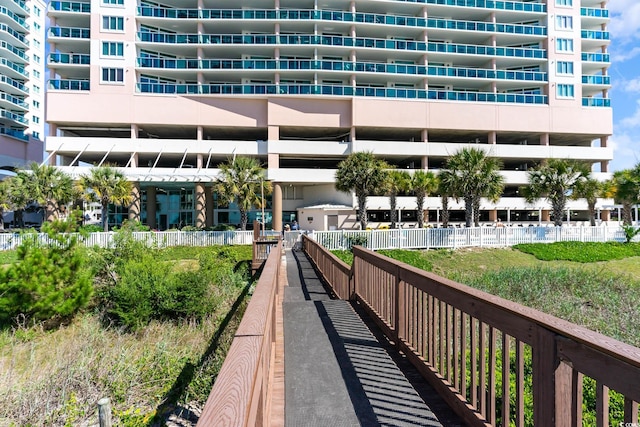 view of community featuring fence