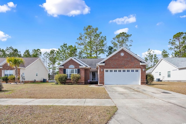 single story home with brick siding, concrete driveway, an attached garage, cooling unit, and a front lawn