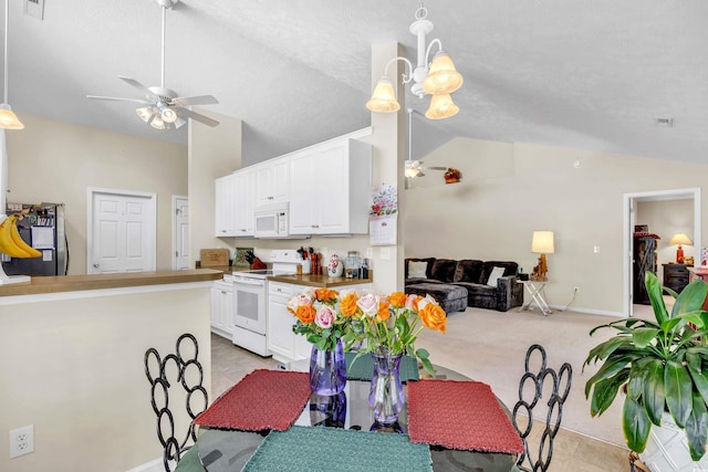 dining area featuring lofted ceiling, ceiling fan, light carpet, and visible vents