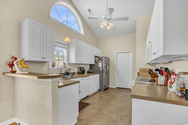 kitchen featuring white appliances, a sink, visible vents, and white cabinetry