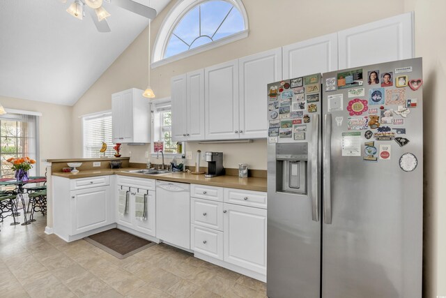 kitchen featuring white cabinets, a sink, white dishwasher, and stainless steel fridge with ice dispenser