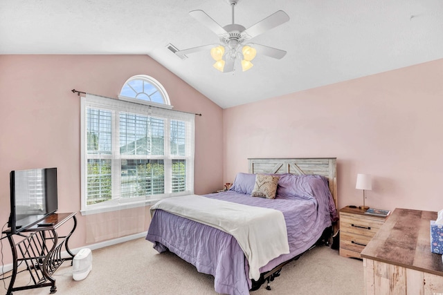 bedroom featuring lofted ceiling, light colored carpet, visible vents, a ceiling fan, and baseboards