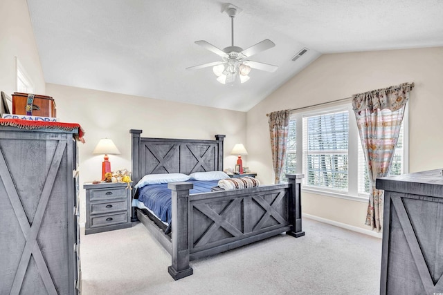 bedroom with carpet, visible vents, a ceiling fan, vaulted ceiling, and baseboards