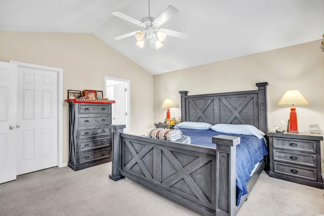 bedroom featuring lofted ceiling, ceiling fan, and light colored carpet