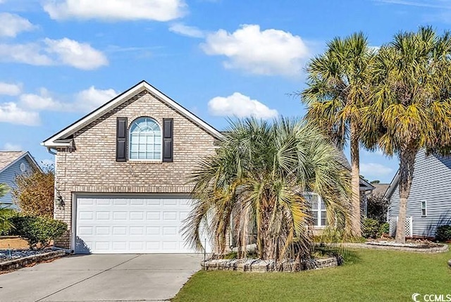 view of front of property with a garage, a front yard, concrete driveway, and brick siding