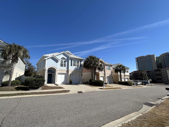 view of front of property with driveway and an attached garage