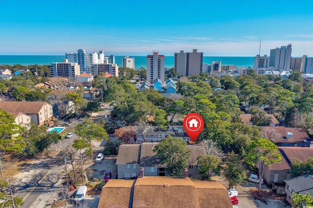 drone / aerial view featuring a water view and a city view