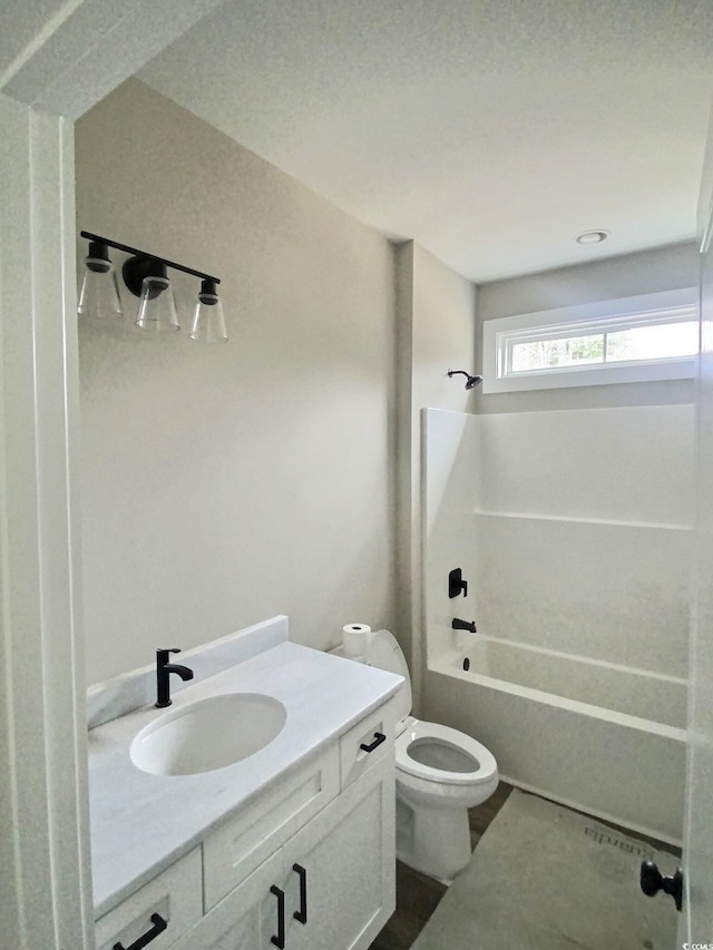 full bath with tub / shower combination, vanity, and toilet