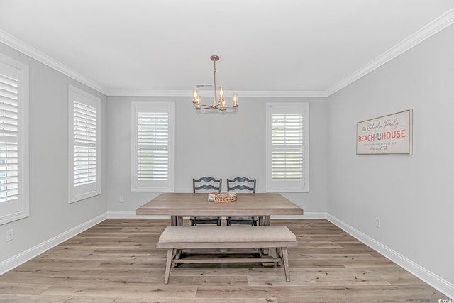 dining area featuring light wood-style floors, breakfast area, and crown molding