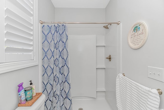 bathroom with a shower with curtain