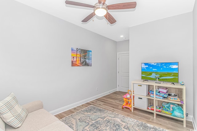 interior space featuring ceiling fan, recessed lighting, wood finished floors, and baseboards