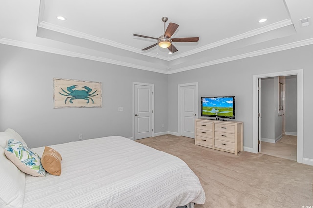 bedroom featuring light carpet, baseboards, a raised ceiling, and crown molding