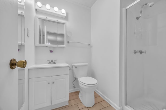 full bathroom with baseboards, toilet, tile patterned flooring, vanity, and a shower stall