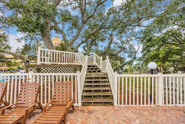 view of patio with stairway and a wooden deck