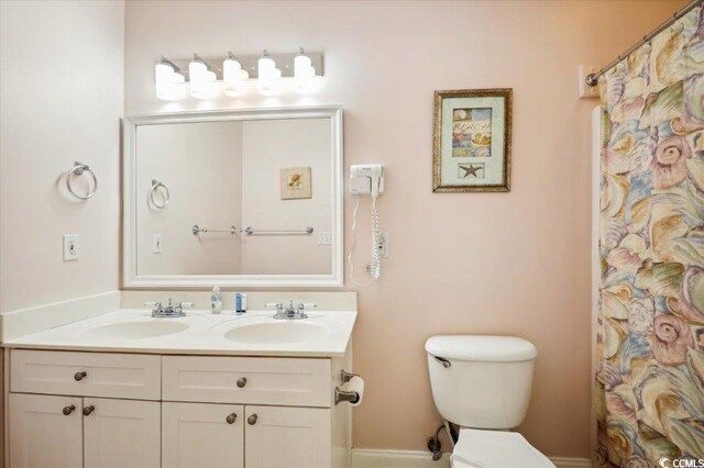817 S Ocean Blvd Unit 105, North Myrtle Beach, SC 29582 - full bathroom featuring toilet and double vanity